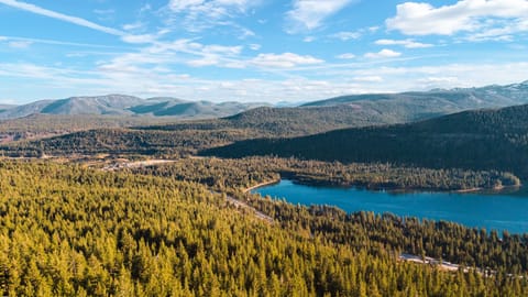 Aerial view of surrounding lakes and mountain terrain.