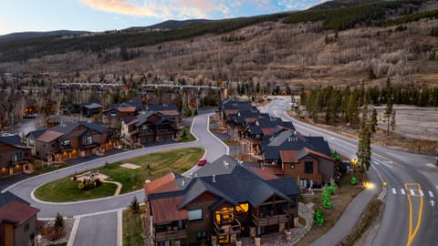 Neighborhood aerial showing winding roads and nearby homes.