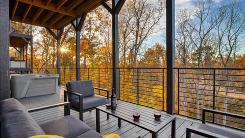 Sip, soak, and savor sweeping forest views from this peaceful lower deck.