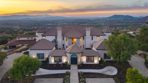 Aerial exterior view of the home at sunset.