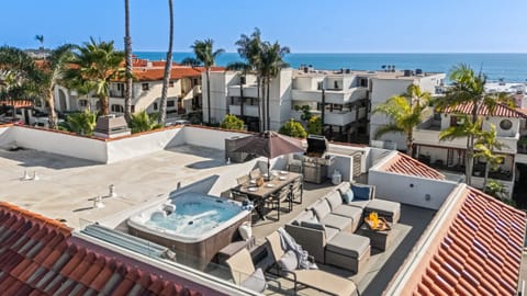 Private rooftop deck with hot tub, ocean views, and coastal breezes — the ultimate Newport Beach escape.