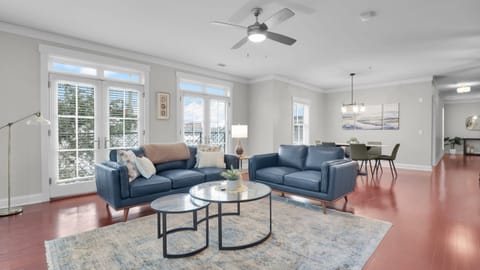 Sunlit open concept living and dining area designed for comfort and connection.