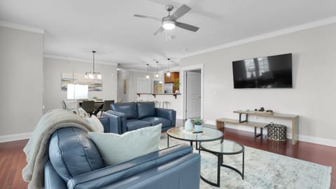 A sunlit, modern living room offering both comfort and style for relaxing moments.