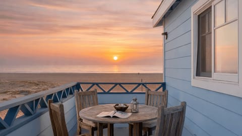 Private balcony dining with unobstructed ocean views.