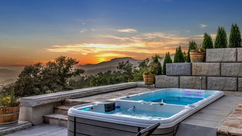 Stunning sunset views over the valley from the private swim spa.