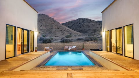 Welcome to your desert oasis—a modern retreat with a private pool and panoramic mountain views.
