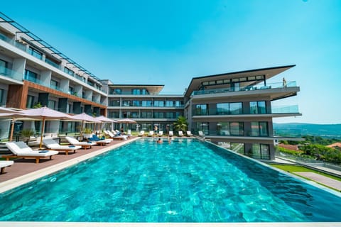 Property building, Patio, Day, Natural landscape, View (from property/room), Balcony/Terrace, Pool view, Sea view, Swimming pool, sunbed