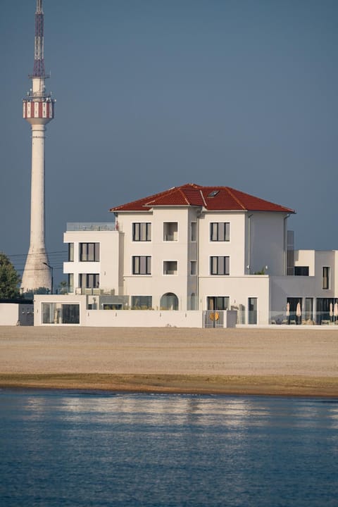 Property building, Day, Natural landscape, Beach, Sea view