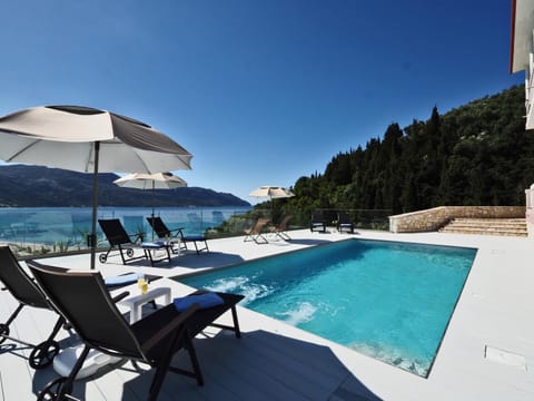 Patio, Natural landscape, Sea view, Swimming pool, sunbed