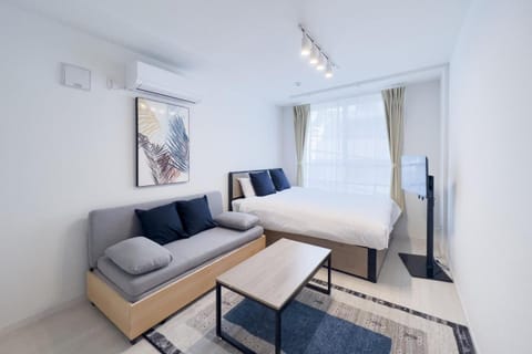 Bed, TV and multimedia, Seating area, Bedroom, air conditioner