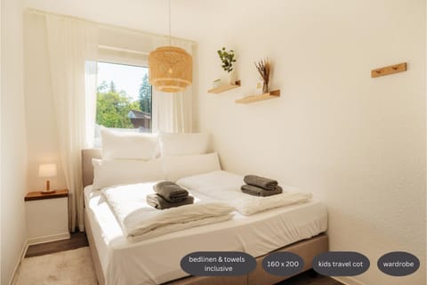 Bed, Photo of the whole room, Bedroom, Text overlay, cot, towels