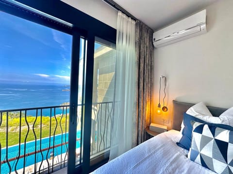 Bed, View (from property/room), Bedroom, Sea view, Swimming pool, air conditioner