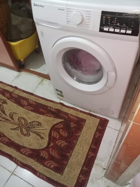 Kitchen or kitchenette, washing machine