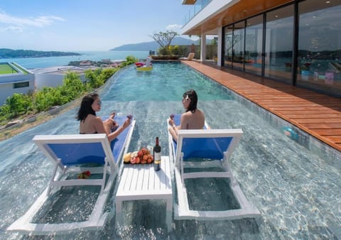 Patio, Day, People, Natural landscape, View (from property/room), Balcony/Terrace, Living room, Seating area, Guests, Lake view, Mountain view, Pool view, River view, Sea view, Swimming pool, Swimming pool, group of guests, sunbed