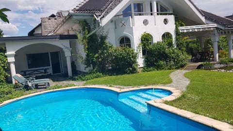 Property building, Patio, Garden, Swimming pool