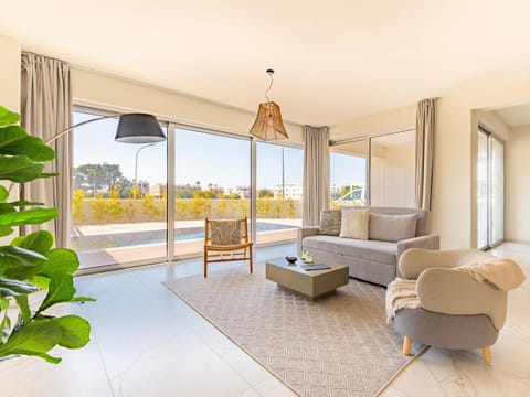 Living room, Seating area, Pool view