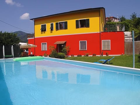 Property building, Facade/entrance, Day, Garden, Pool view, Swimming pool, sunbed