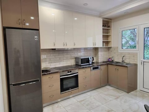 Kitchen or kitchenette, dishwasher, oven, stove