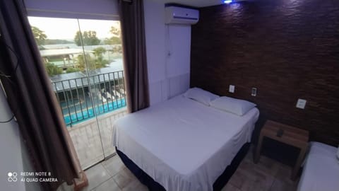 Bed, View (from property/room), Balcony/Terrace, Photo of the whole room, Bedroom, Pool view, Swimming pool, air conditioner