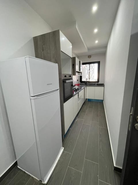 Kitchen or kitchenette, dishwasher, oven, stove