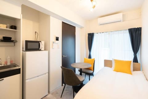 Bed, Seating area, Bedroom, minibar, air conditioner