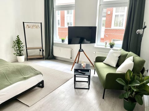 Bed, TV and multimedia, Living room, Seating area