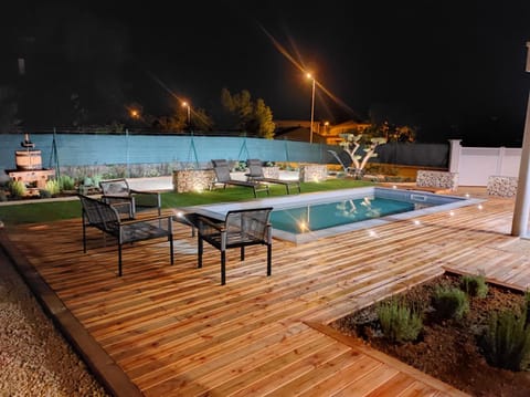 Patio, Night, Pool view, Swimming pool, sunbed