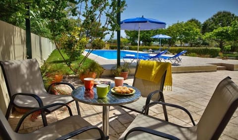 Patio, Seating area, Pool view, Swimming pool, sunbed