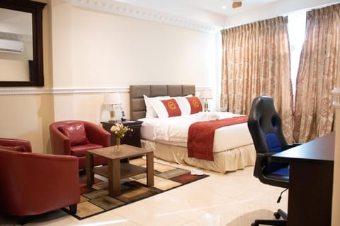 Bed, TV and multimedia, Living room, Seating area, Bedroom, hair dresser