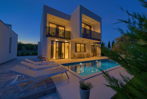 Property building, Patio, Night, Garden, Seating area, Pool view, Swimming pool, sunbed