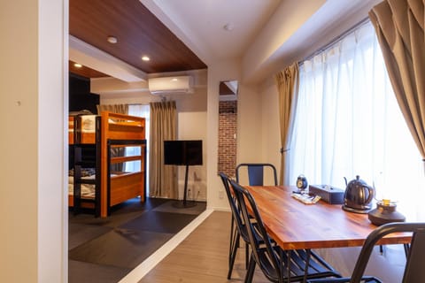 Seating area, Dining area, bunk bed, air conditioner