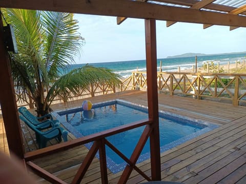 Villa Devonia - Beachfront Cabins with Pool at Tela, HN House in Atlántida Department