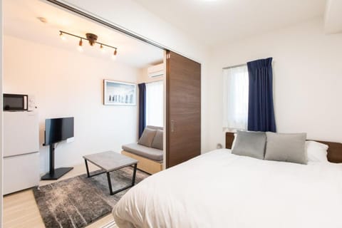 Bed, TV and multimedia, Living room, Seating area, Bedroom, minibar, air conditioner