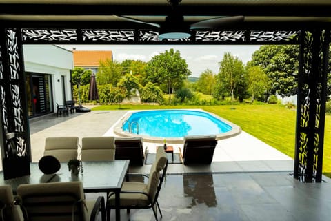 Patio, Seating area, Pool view, Swimming pool, sunbed