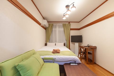 Bed, TV and multimedia, Seating area, Bedroom, air conditioner