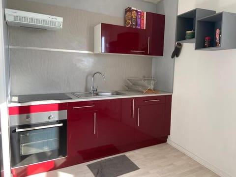 Kitchen or kitchenette, oven, storage, stove