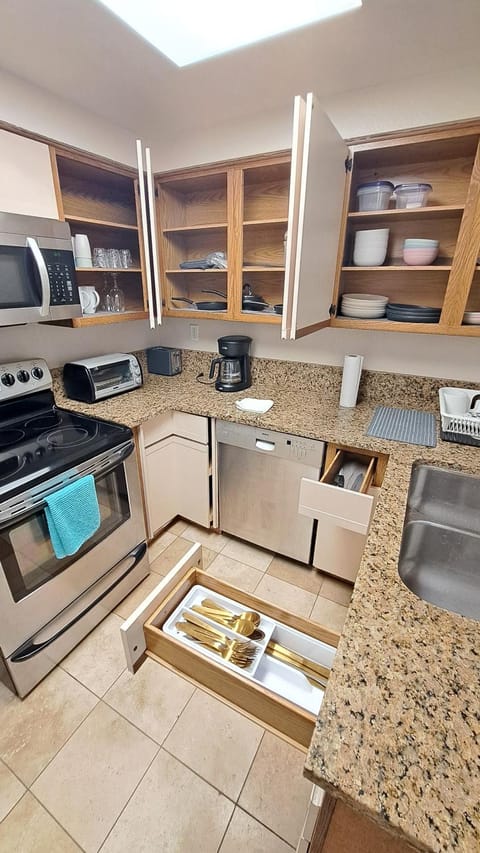 Kitchen or kitchenette, dishwasher, oven, stove, toaster