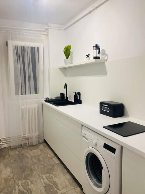 Kitchen or kitchenette, washing machine