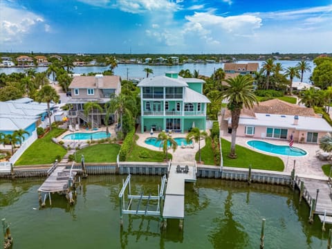 Waterfront Luxury w/ Heated Salt Pool & Golf Cart House in Indian Rocks Beach