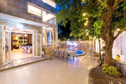 Property building, Patio, Night, Natural landscape, Garden, Garden view, Pool view, Swimming pool, sunbed