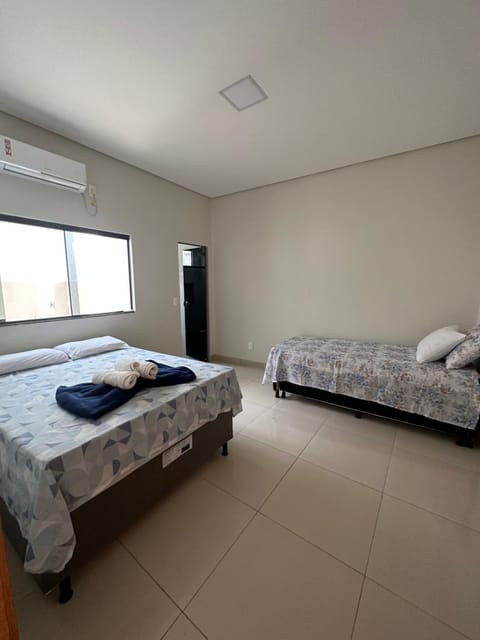 Bed, Photo of the whole room, Bedroom, towels, air conditioner