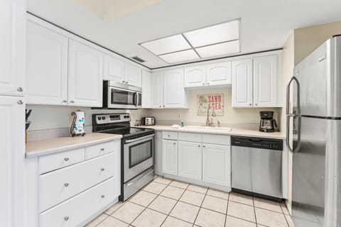 Kitchen or kitchenette, dishwasher, oven, stove