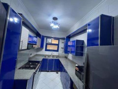 large Apartment of three rooms in front of auc Condo in New Cairo City