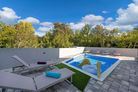 Patio, Day, Natural landscape, Pool view, Swimming pool, sunbed