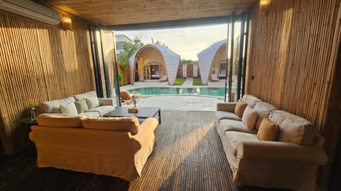 Living room, Seating area, Pool view