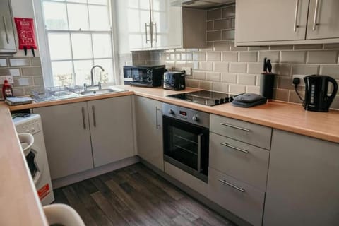 Kitchen or kitchenette, oven, stove, toaster