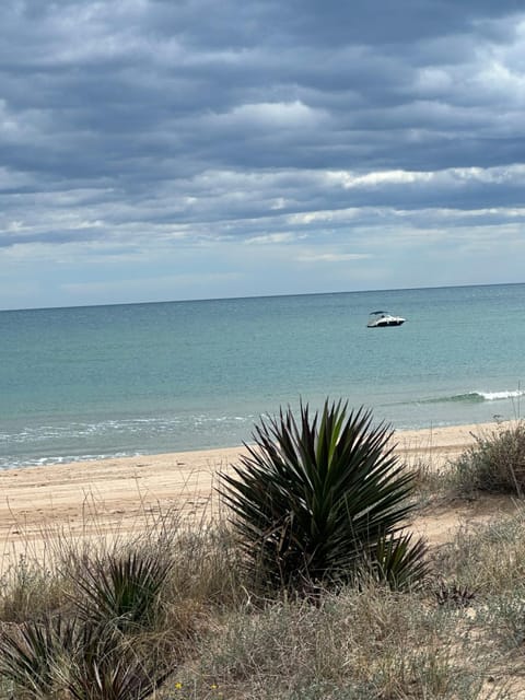 Chalet adosado en la playa de El Perellonet con piscina, pista tenis House in Ribera Baixa