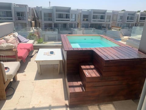 Property building, Patio, Day, View (from property/room), Balcony/Terrace, Seating area, Pool view, Swimming pool