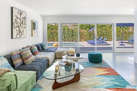 Living room, Seating area, Pool view