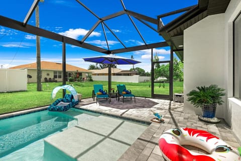 Perfect Oasis Retreat ! 2023 Luxury Built Home, Heated Pool and Games House in Cape Coral